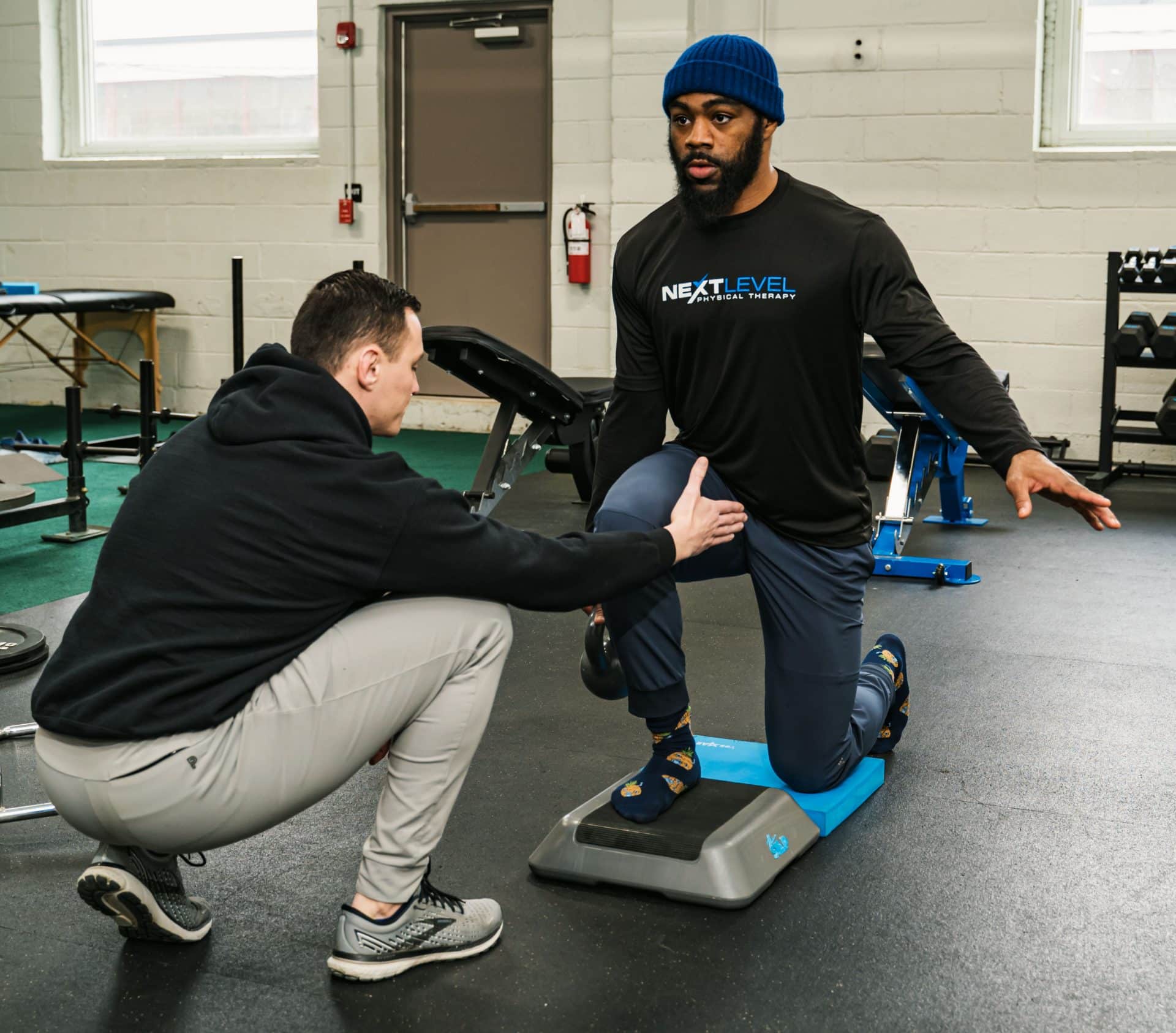 Physical Therapist helping an Athlete with ACL recovery