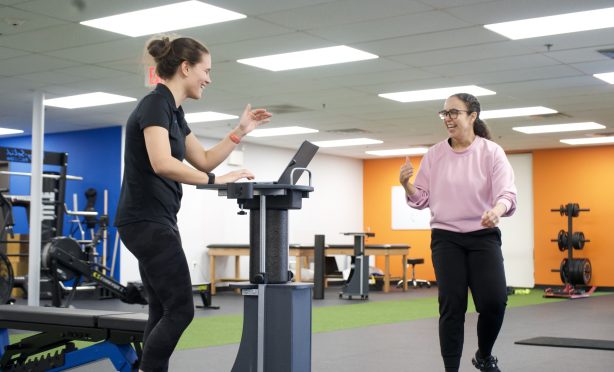 Client and physical therapist celebrating a win during one on one physical therapy at Next Level Physical Therapy in Marlton, NJ