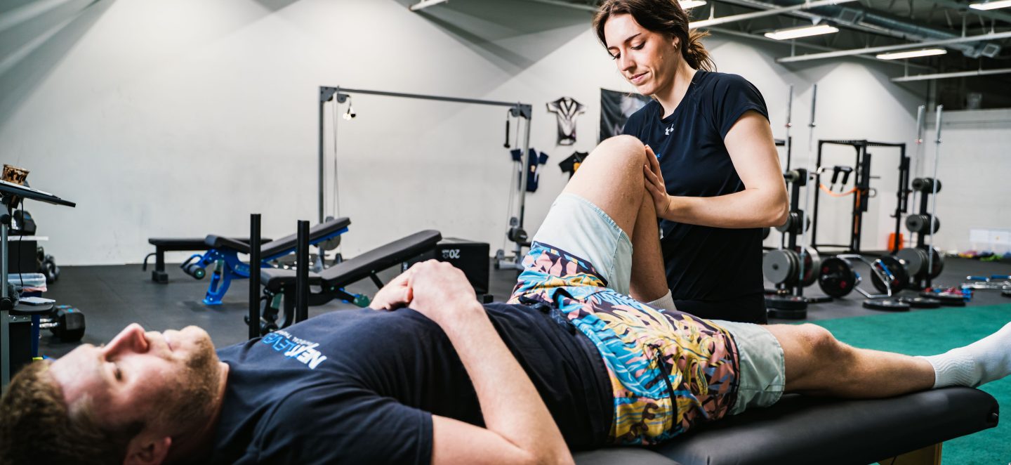 Physical therapist working on a patient who is lying down at Next Level Physical Therapy in Southampton, PA