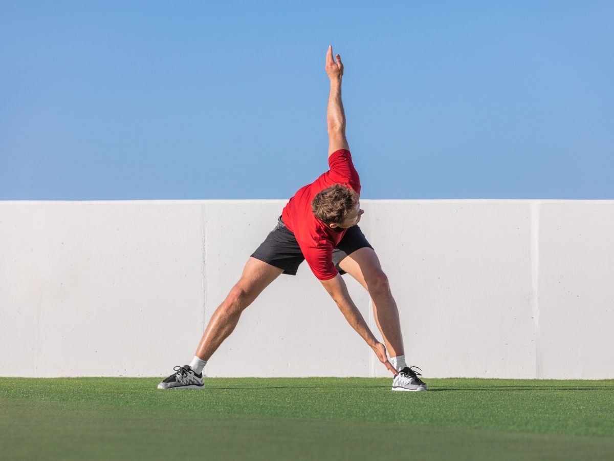ATHLETE PERFORMING A DYNAMIC WARM-UP BEFORE TRAINING