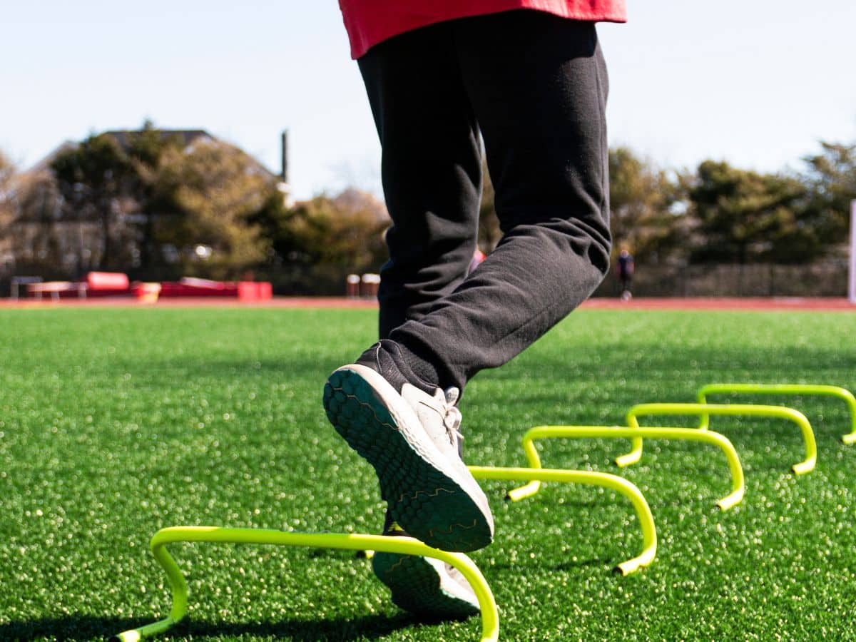 ATHLETE PERFORMING RETURN-TO-SPORT TEST SINGLE-LEG HOP AGILITY DRILL