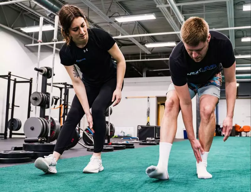 Physical therapist working with a patient on lunges at Next Level Physical Therapy in Southampton, PA