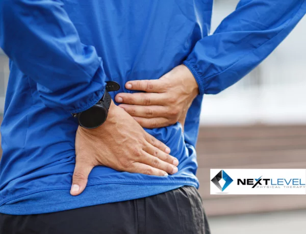Man holding his back from sciatica pain after exercise