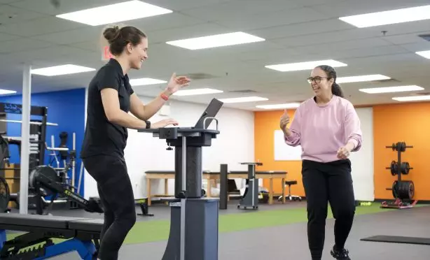 Client and physical therapist celebrating a win during one on one physical therapy at Next Level Physical Therapy in Marlton, NJ